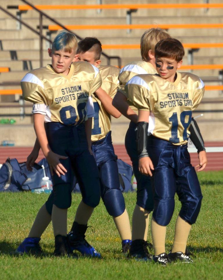 Youth tackle football players